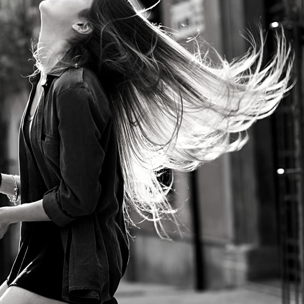long blonde hair highlights blowing in wind woman head tilted back