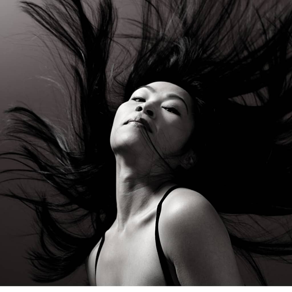 long hair extensions remy hair asian woman hair brunette is blowing in wind
