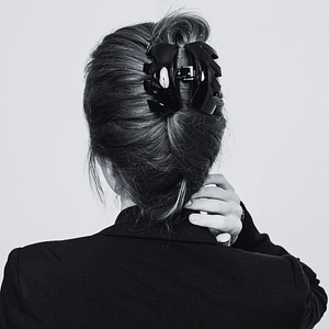 clip-in hair extensions tied up with a jaw hair clip