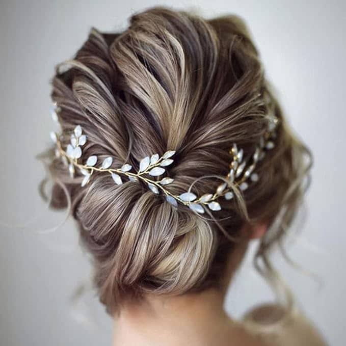back view of wedding hair accessory vine cascading through wedding hair updo